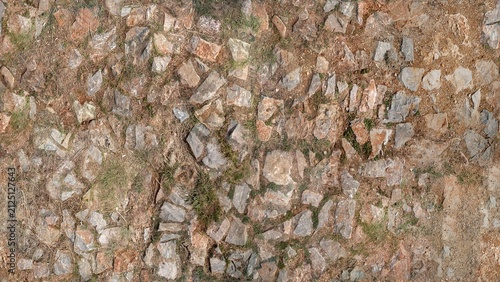 Canvas Print Overhead view of an old, weathered stone pavement with irregularly arranged stones, worn surfaces, natural cracks, and subtle variations in earthy gray and brown tones