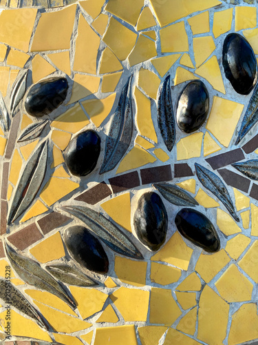 Canvastavla Close-up of decorative olive mosaic with black olives and olive leaves made of ceramic tiles
