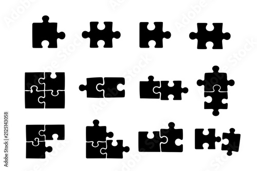Variety of Puzzle Pieces in Different Shapes Arranged on White Background