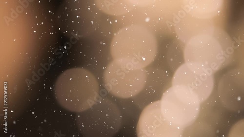 Abstract golden bokeh background with glowing lights and falling snow. Perfect for Christmas, New Year, winter holiday designs, wallpapers, banners and seasonal projects.