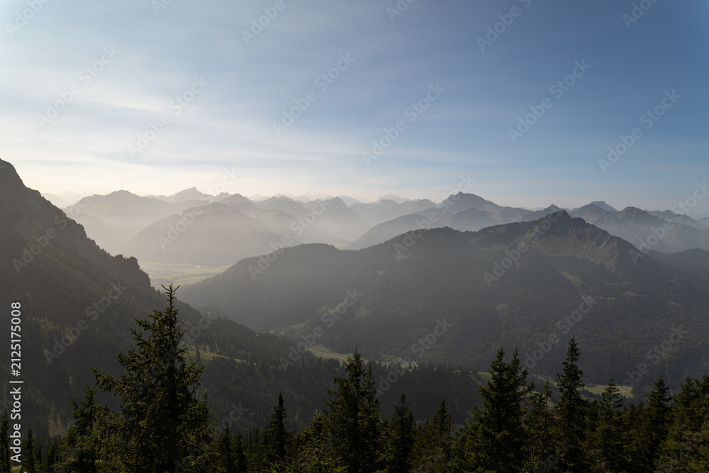 Fototapeta premium Layered alpine ridges stretching toward the horizon
