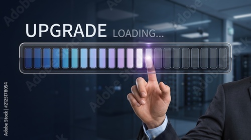 Tapety artystyczne Enterprise software maintenance showing IT administrator touching digital system upgrade loading progress bar