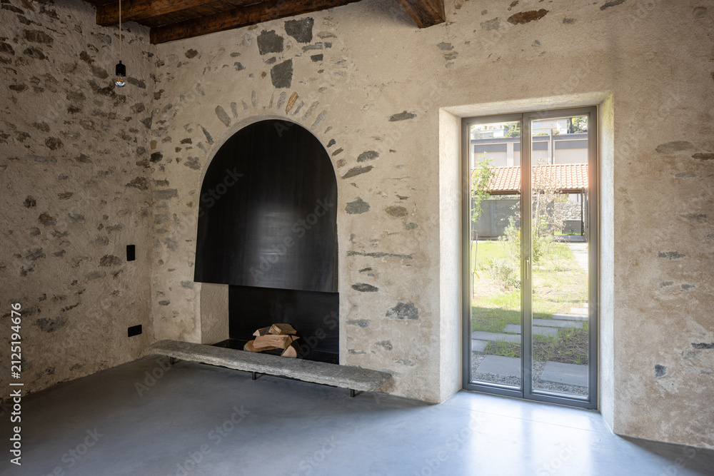 Obraz premium Detail of a French window. Interior of a room with a fireplace and a window; no people inside.