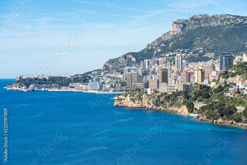 Scenic view of Monaco skyline rising above the blue Mediterranean Sea on the French Riviera