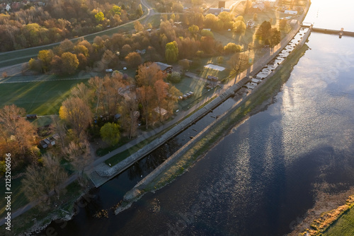 Aerial view of the Vltava river in Prague with the artificial white water canal ready for canoeing and kayaking. Early morning atmosphere by the sports venue as seen from the air.