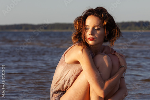 A Woman Sitting In Water