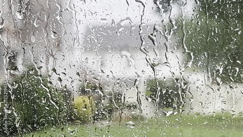 Raindrops on a car window during a storm.