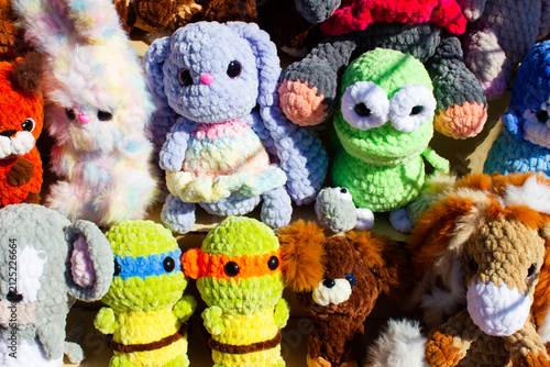 Knitted stuffed animals. Colorful plush toys. Children toys knitted from yarn a gift, a handmade item.