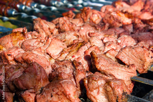 Grilling pieces of meat on skewers over a charcoal grill. Cooking a traditional shashlik over charcoal. Cooking meat on vacation authentic image wallpaper