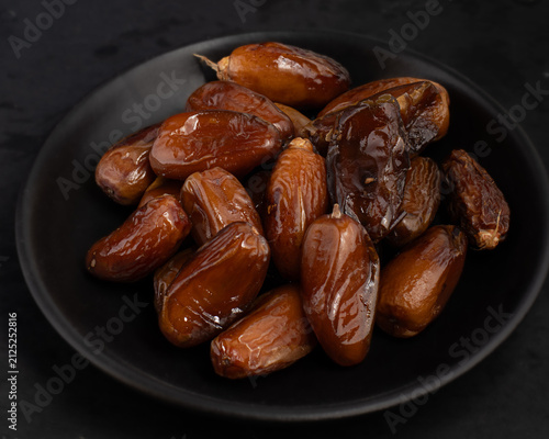 Macro View of Sweet Dates in Black Bowl