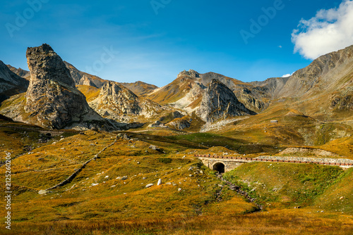 Mountains in autumn under blue sky on Italian-Swiss border.