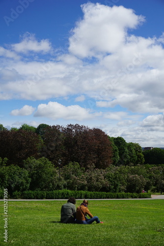 young couple sitting on the grass