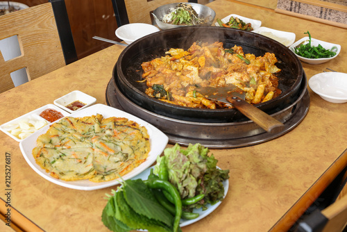 Spicy Korean Chicken Stir Fry Dakgalbi with Vegetables on Iron Pan