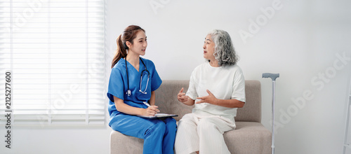 Healthcare professional advises senior woman about health concerns during comprehensive medical consultation providing wellness support in modern clinic setting