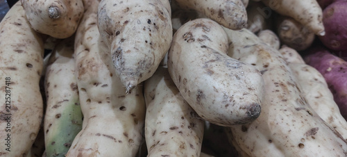 white sweet potato on display at the farmers market.