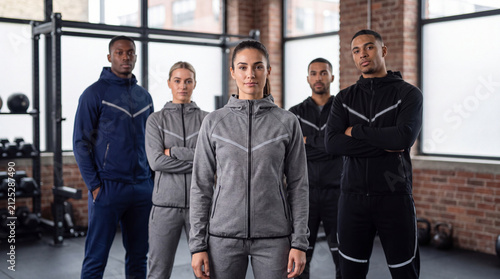 Athletic group posing in gym