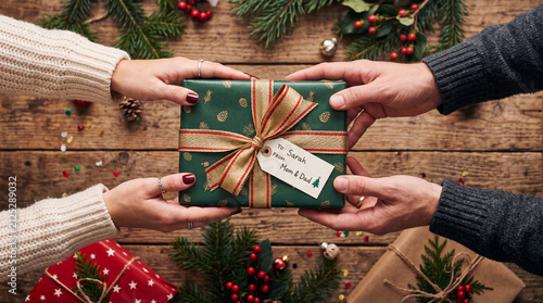 man holding christmas gift