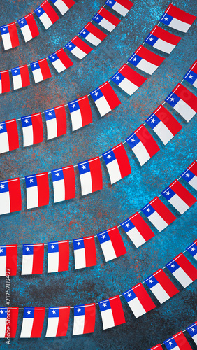 Chilean flags forming a festive garland on a blue background