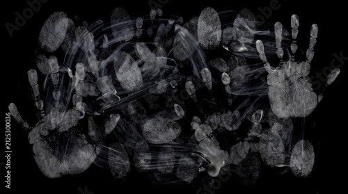 Abstract display of overlapping fingerprints and handprints on a dark background showcasing human touch and connection