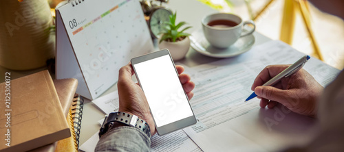 Budget and Tax planning concept. Accountant hand using calculator and review tax forms. Represents personal finance, tax preparation, budgeting, and season to pay tax-banner image