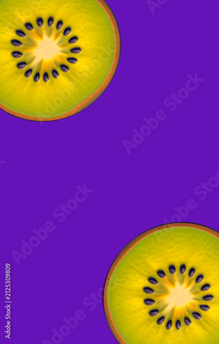 Two slice of green kiwi on a purple background. Fruit, symmetry, colors, book cover
