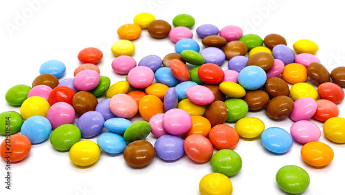 Colorful Candy Coated Chocolate Dragees Scattered on White Background