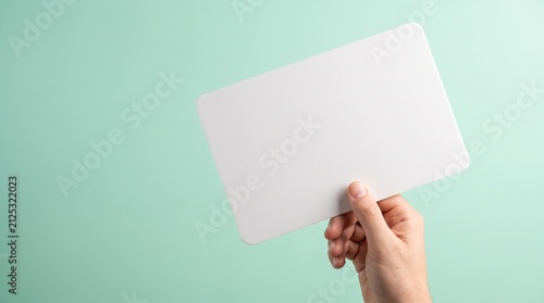 hand-holding-blank-presentation-signboard-copy-space-mint-background.jpg