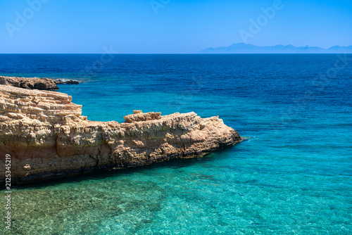 Rocky coastline with Aegean Sea, Koufonisi, Cyclades, Greece