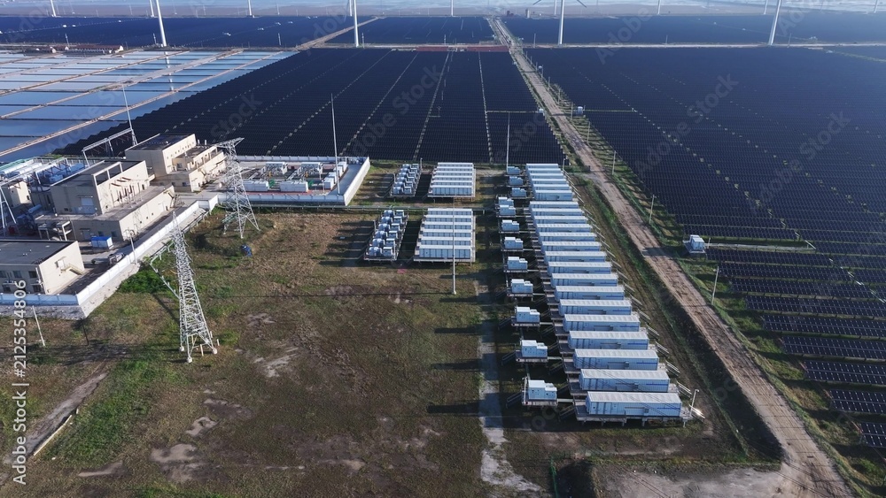 Fototapeta premium Aerial view of a large-scale photovoltaic power station with battery energy storage systems