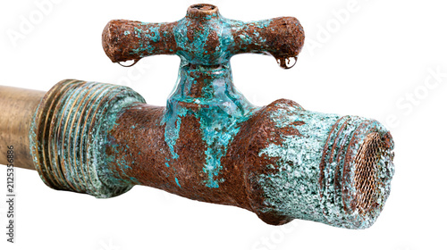 Obraz na płótnie Old rusty brass water tap with verdigris patina and dripping water, isolated on