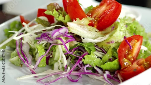 Fresh healthy vegetable salad rotating slowly