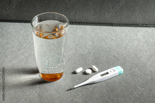 Принти на полотні Digital thermometer, medicine and glass of water on table