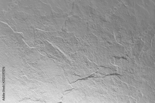 Abstract gray stone texture background with rough relief surface and natural slate rock patterns.