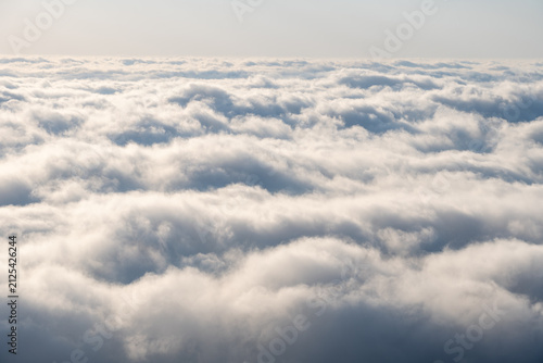 Endless Sea of Clouds Above the Horizon with Soft Atmospheric Sky.