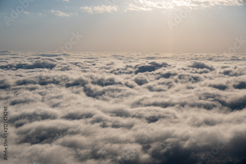 Endless Sea of Clouds Above the Horizon with Soft Atmospheric Sky.