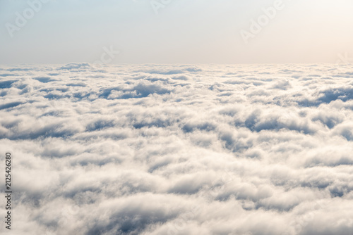 Endless Sea of Clouds Above the Horizon with Soft Atmospheric Sky.