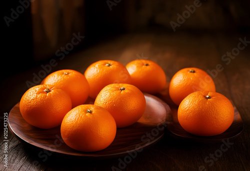 Fresh whole oranges on dark...