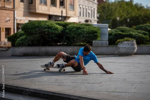 Bild auf Leinwand Skater falling down from skateboard in urban city