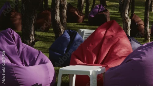 A recreation area for park visitors with soft seating in the shade of trees