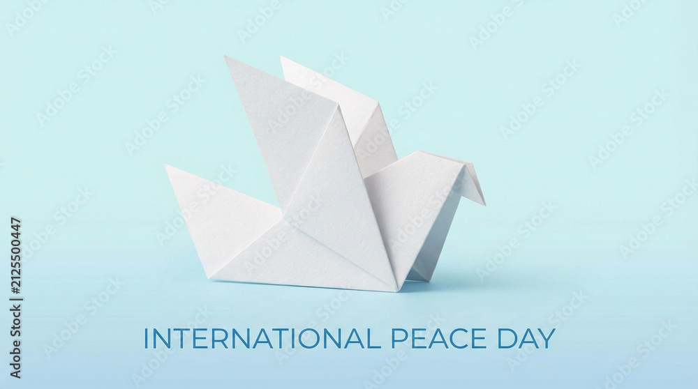 Obraz premium Minimalist White Dove Origami Peace Symbol. Single geometric paper dove in pure white against soft blue gradient representing international peace day