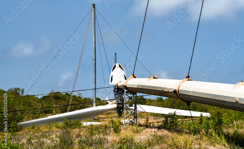 Obraz na plátne Old wind turbine lowered near the ground at Parc eolien du Souffleur in La Desir