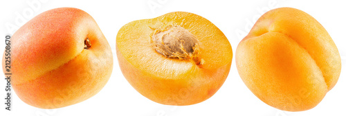 Three fresh apricots including a sliced one isolated on a white background