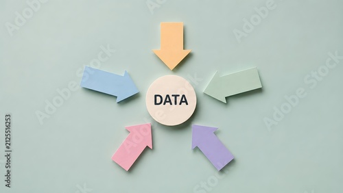 Pastel paper arrows pointing towards central data text circle representing information collection data centralization and network management
