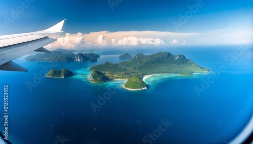 airplane window view of tropical islands on a sunny day