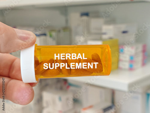 Fotografie HERBAL SUPPLEMENT natural health concept represented by brown compressed tablets