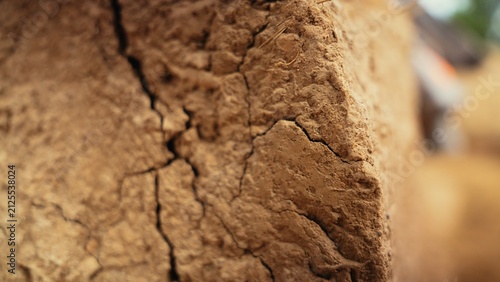 Cracked dry earth showcasing a detailed texture and patterns caused by drought and extreme heat, symbolizing environmental change, scarcity, and resilience in arid conditions