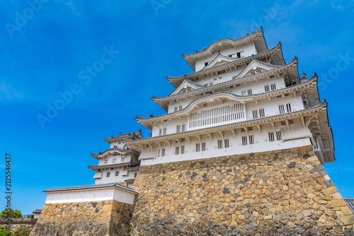 Canvas Print The historic white Himeji Castle complex against a blue sky in Hyogo, Japan
