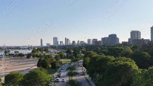 Aerial Drone View of Downtown Milwaukee Skyline with Lakefront Highway and Green Park, Wisconsin”