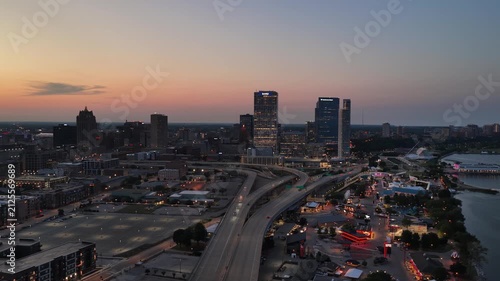 Aerial View of Milwaukee Skyline at Dusk with Highway Interchange and Lakefront” on August 3 2026 