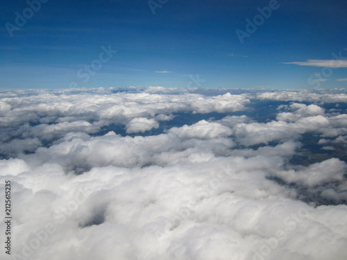 Obraz na płótnie Aerial view of clouds floating over vast land area